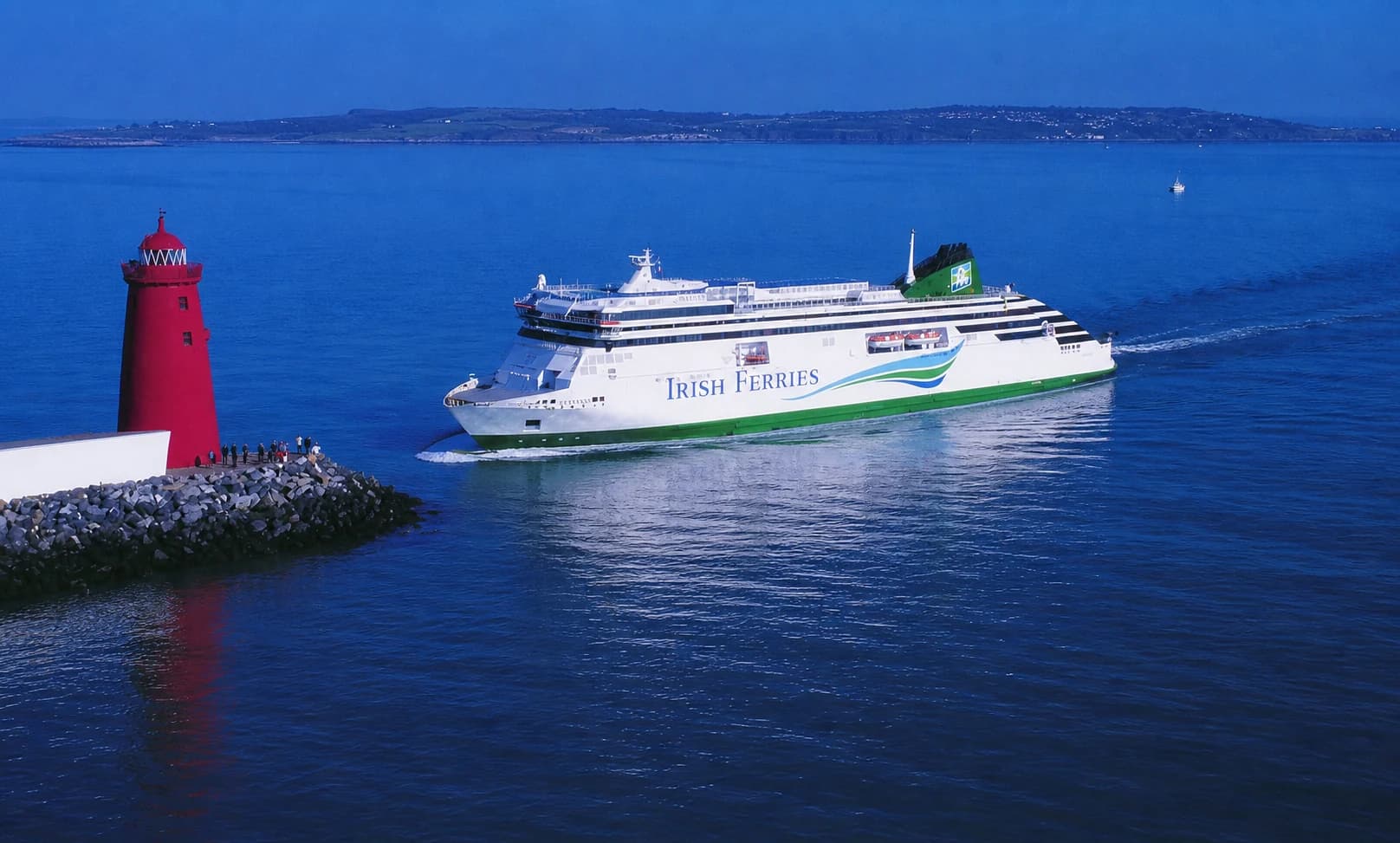 A ferry leaving Dublin past the Poolbeg lighthouse